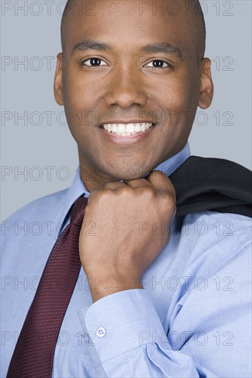 Portrait of happy mid adult businessman. Photo: Rob Lewine