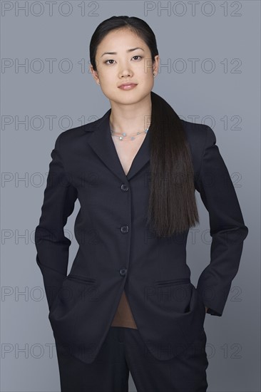 Portrait of happy young businesswoman. Photo : Rob Lewine