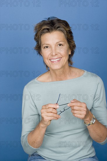 Portrait of happy mature woman. Photo : Rob Lewine