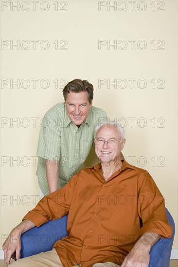 Portrait of senior man with adult son. Photo: Rob Lewine