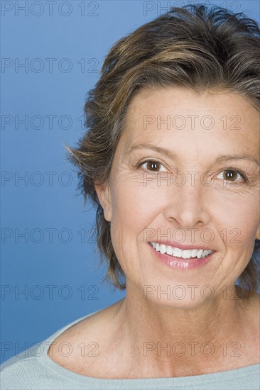 Portrait of happy mature woman. Photo : Rob Lewine