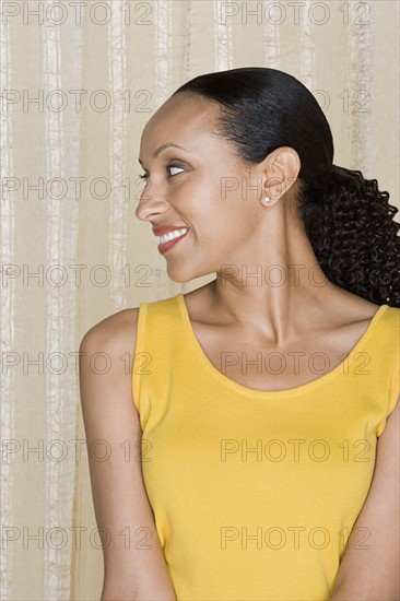 Portrait of happy mid adult african woman. Photo: Rob Lewine