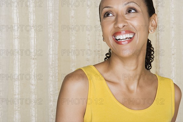 Portrait of happy mid adult african woman. Photo: Rob Lewine