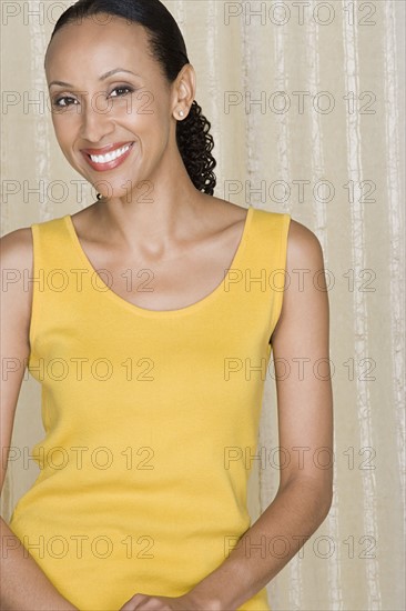 Portrait of happy mid adult african woman. Photo : Rob Lewine