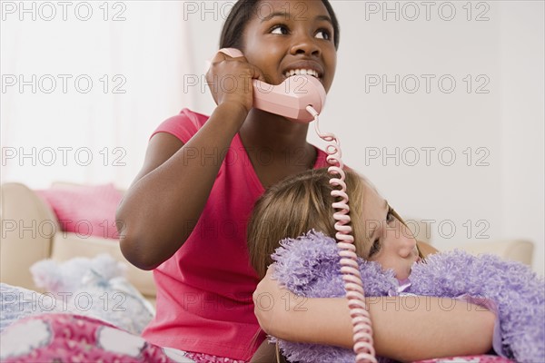 Two girls (10-11) having fun at slumber party. Photo: Rob Lewine