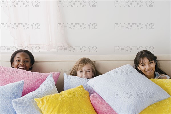 Three girls (10-11) having fun at slumber party. Photo : Rob Lewine