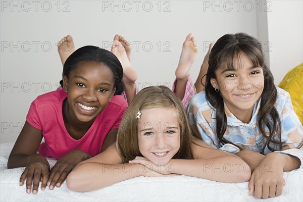 Three girls (10-11) having fun at slumber party. Photo: Rob Lewine