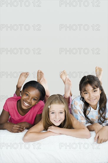 Three girls (10-11) having fun at slumber party. Photo: Rob Lewine