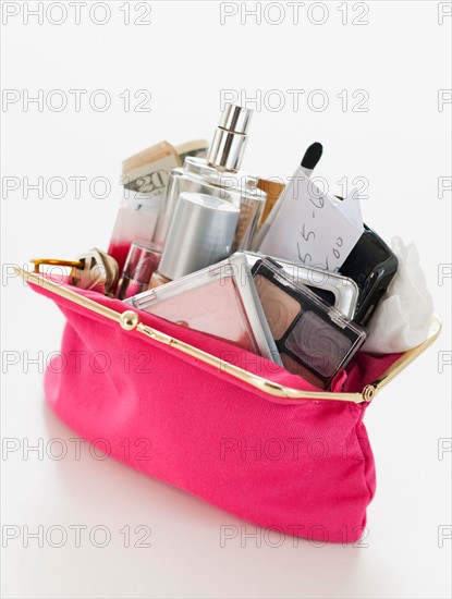 Woman's purse overflowing.