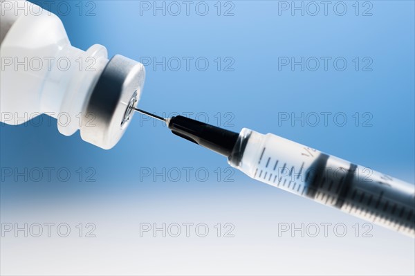 Studio shot of syringe and vial.