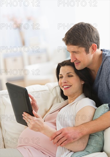 Couple using tablet pc.