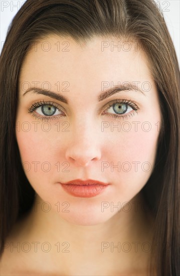 Studio portrait of young woman.