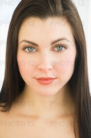 Studio portrait of young woman.