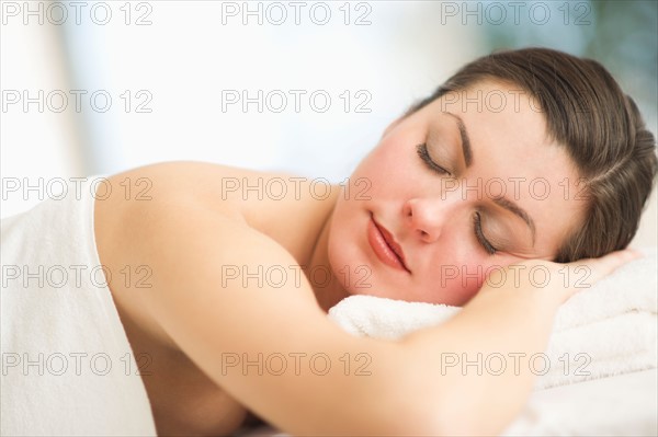 Woman relaxing in spa.