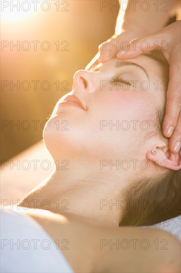 Woman receiving face massage.