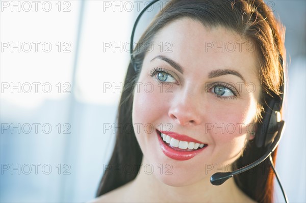 Portrait of female customer service representative.