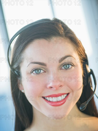 Portrait of female customer service representative.