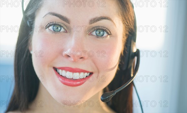 Portrait of female customer service representative.