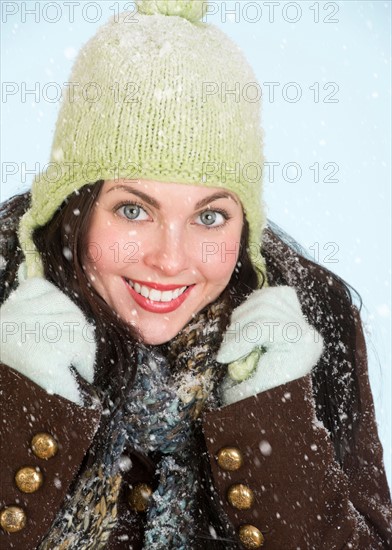 Studio portrait of woman in winter clothing.