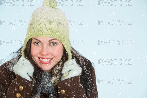 Studio portrait of woman in winter clothing.