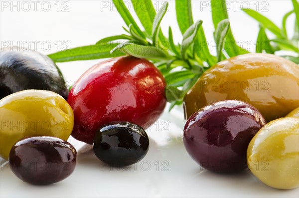 Close-up of various olives, studio shot.