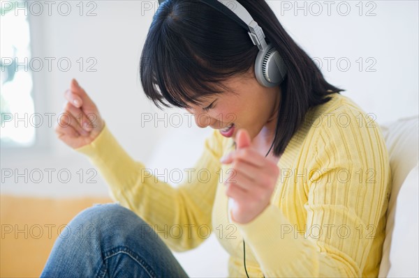 Smiling woman listening music.