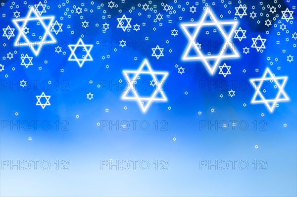 Stars of David against blue background, studio shot.