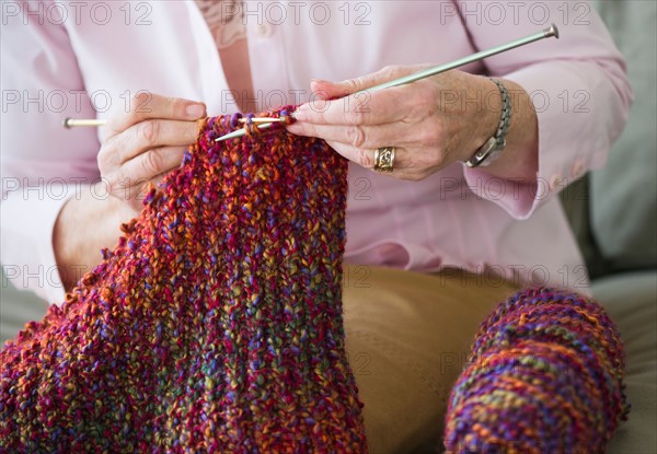 Senior woman knitting, close-up.