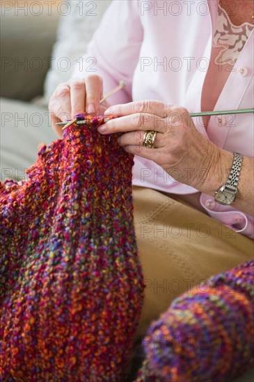 Senior woman knitting, close-up.