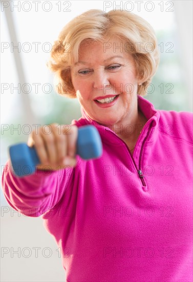 Portrait of smiling senior woman training.