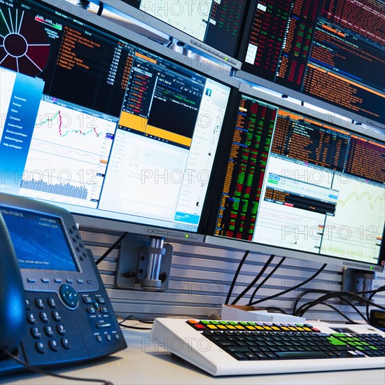 Monitors above trading desk.