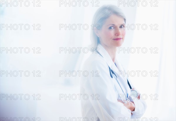 Portrait of senior female doctor .