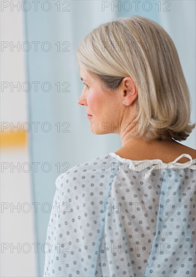 Rear view of senior female patient in hospital.