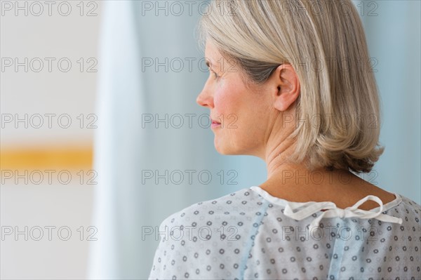 Rear view of senior female patient in hospital.