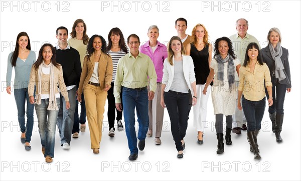 Studio portrait of large group of people walking arm in arm.