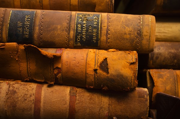 Close up of antique books in leather covers, studio shot.