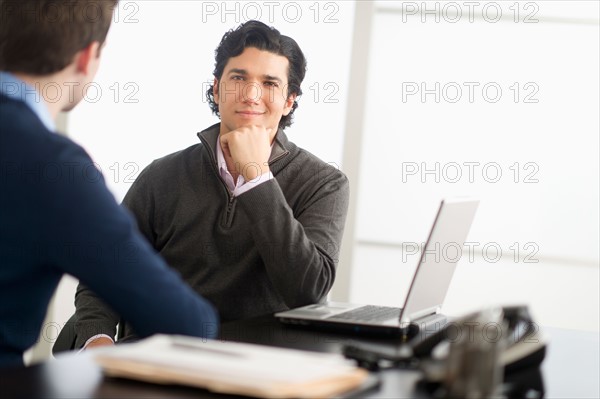 Two businessmen in discussion.