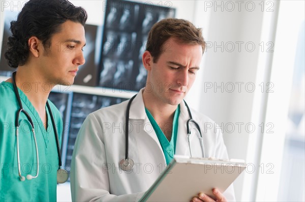 Two male doctors working in hospital.