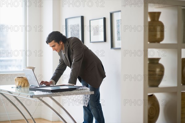 Man working in his art gallery.