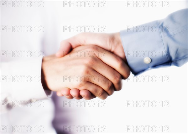 Two businessman shaking hands.