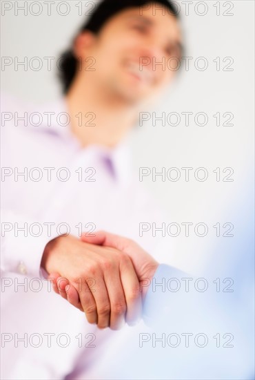 Two businessman shaking hands.