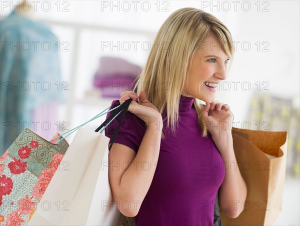 Woman holding shopping bags.