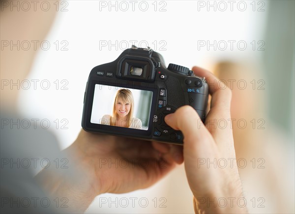 Man holding digital camera.