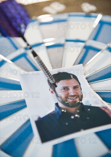 Photograph of man stuck with darts. Photo : Jamie Grill