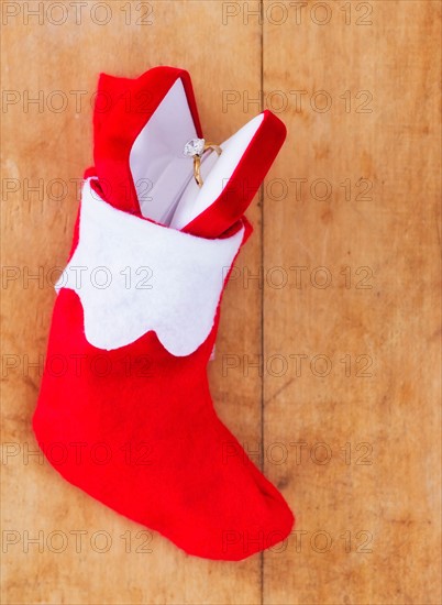 Christmas stocking with engagement ring. Photo : Daniel Grill