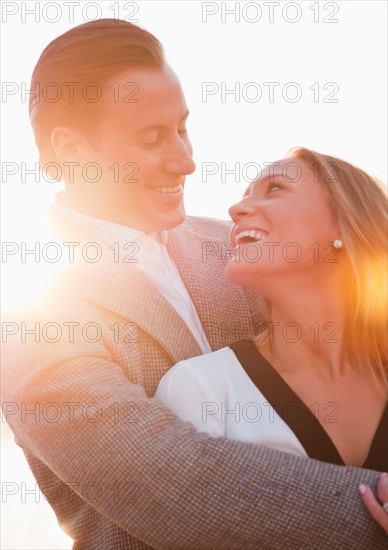 Young couple flirting outdoors. Photo : Daniel Grill
