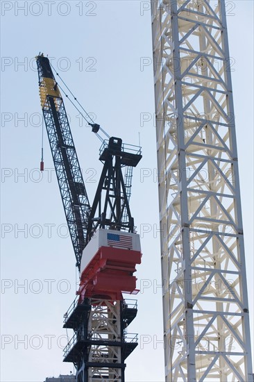 Crane at construction site. Photo : fotog