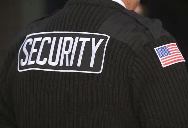 Inscription on man's uniform. Photo : fotog