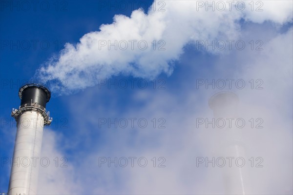 part of chimneys coverred by smoke. Photo : fotog