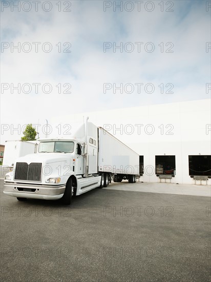 Truck loading in warehouse.